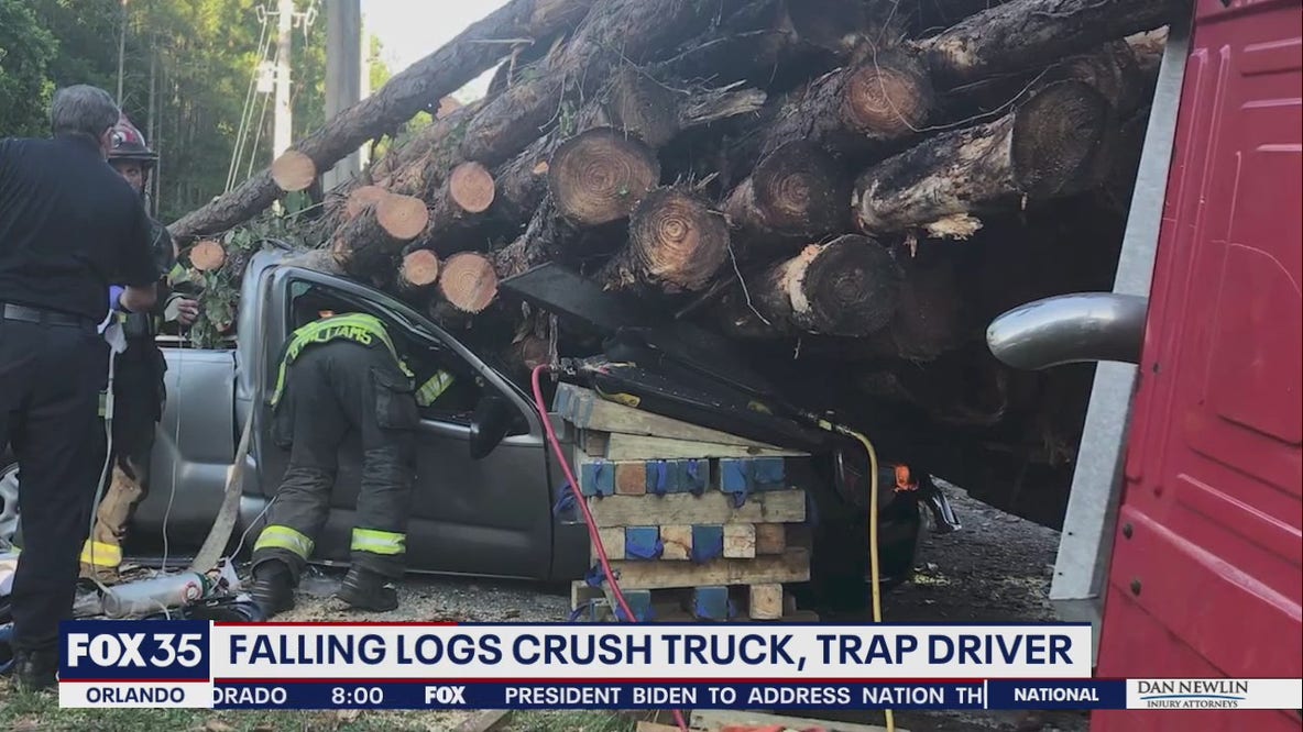 Florida man rescued after log hauler flips, falls on his truck